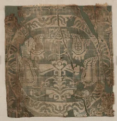 Rundel med kantigt palmettträd, från tunika, 650-850.