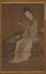 Ung kvinna som läser en diktbok, Mingdynastin, 1500-1600-talet.