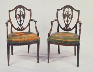 Ett par matstolar i rosenträ av George III, efter design av George Hepplewhite