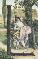 L: En kvinna som bär blommor i håret höjer sina underkjolar för att skissa på ett danssteg. Landsdekor - Alfabettecken Ref Th. E., L. Theochrom - Serie 994. Theodor Eisman, förläggare, Leipzig