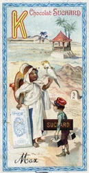 Bokstaven K: kabyle, kepi, kilogram, kakatoes, kiosk, kilometer. Gravyr av alfabetet redigerad av Chocolat Suchard, början av 1900-talet. 24 kromolitografier som representerar platser, karaktärer och föremål som ska upptäckas i bilden. Mått: 105x55mm