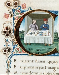 Dekorerad initial C med ett par vid bordet. Miniatyr ur "Bucolica" (Ekloger) av Vergilius (Publius Vergilius Maro) (70-19 f.Kr.) (ms. IV E.12) - 1400-talet, Neapel, Biblioteca Nazionale