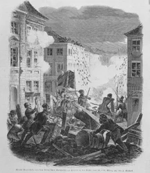 Revolutionen i mars 1848: barrikad i Berlin den 19/03/1848. Fredrik Vilhelm IV av Preussen kommer att ledas att acceptera återförening och en liberal regering.