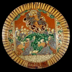 Tallrik i lackad jord som representerar Kristi himmelsfärd. 1752. Sevres, Nationalmuseum för Keramik
