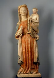 Jungfru och barn Jungfrun håller en duva i handen. Polykrom stenskulptur. 1400-talet. Kyrkan Montaigu les Bois.