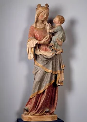 Jungfru och barn Barnet håller i duvan. Polykrom stenskulptur från början av 1300-talet. Champeuil, församlingskyrka