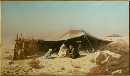 Araber i öknen som läser Koranen