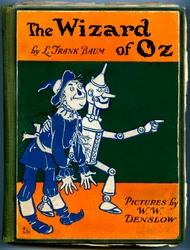The Wonderful Wizard of Oz - The Wizard of Oz: omslag till en gammal upplaga (mellan 1905 och 1920) illustrerad av Denslow, William Wallace (1856-1915) av Frank Baums bok (1856-1919) - fågelskrämman och trämannen i tenn - privat samling -